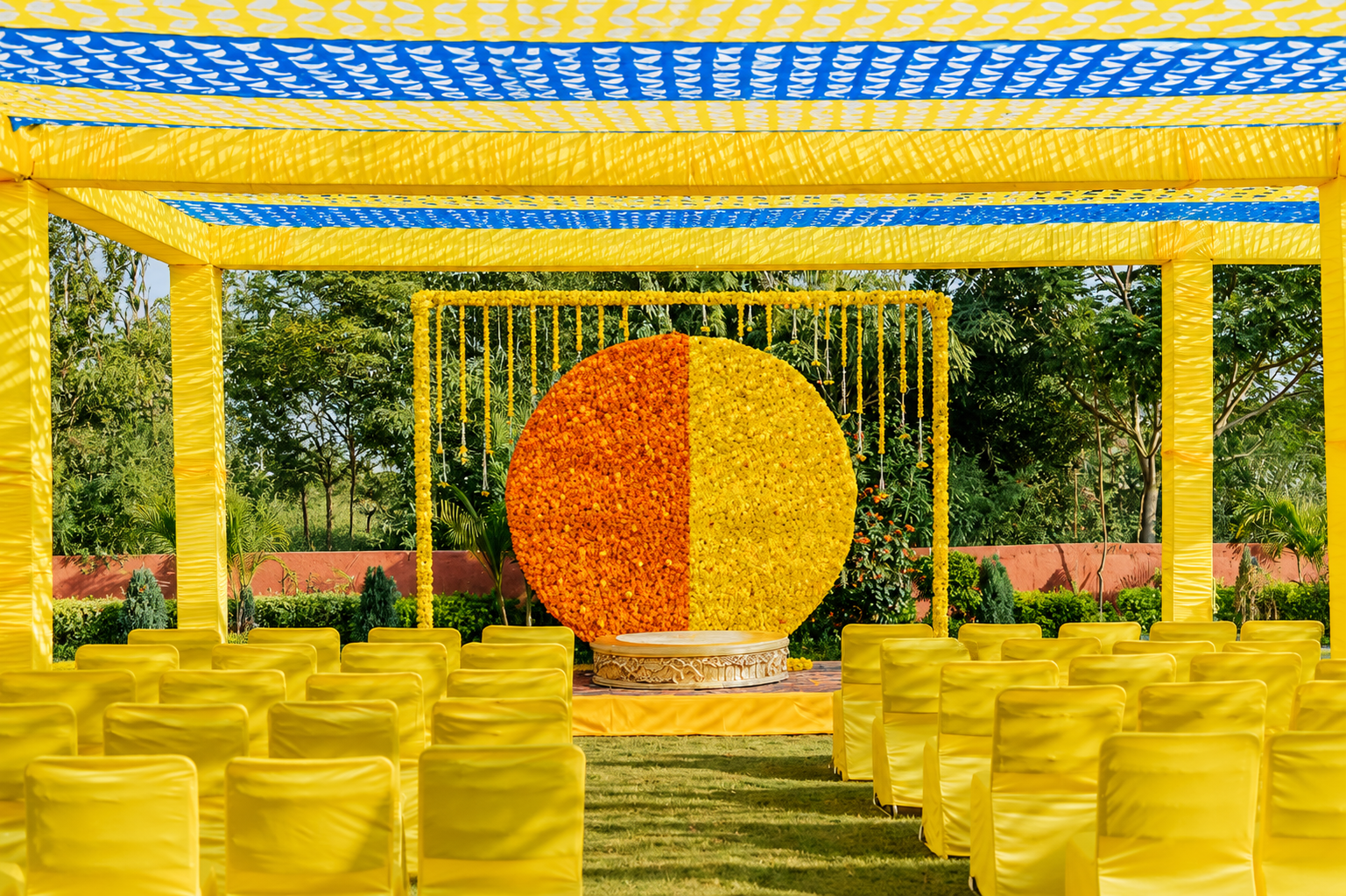Yellow and orange marigold circular backdrop for daytime function
