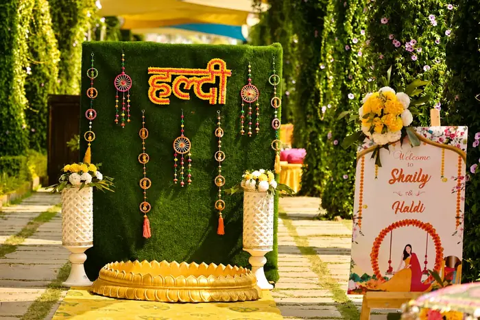 Haldi ceremony backdrop with marigold Haldi sign and tassels